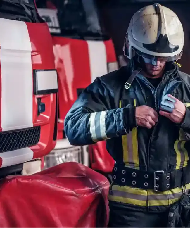 fireman-wearing-protective-uniform-standing-next-t-8ASJL9D